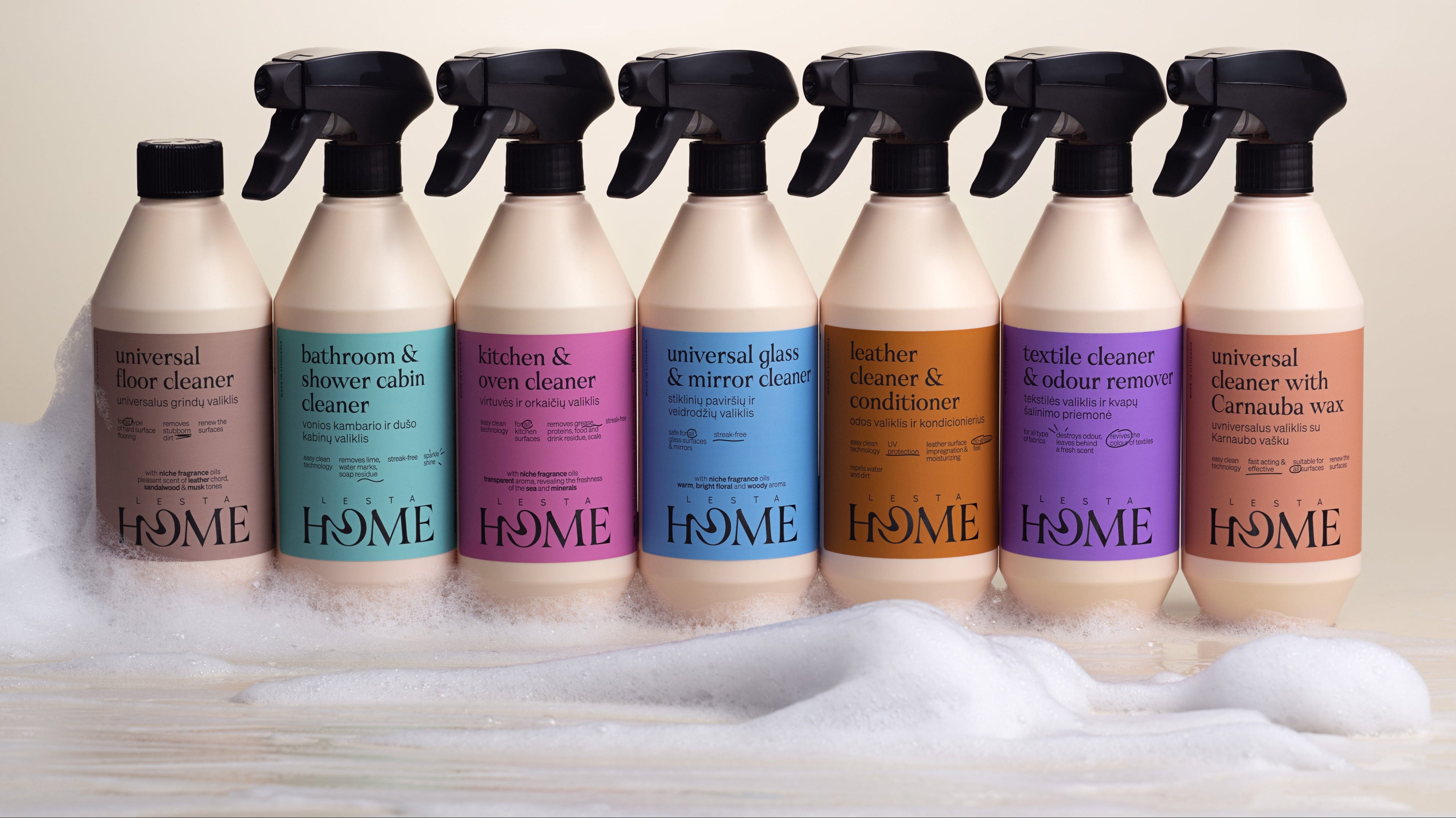 Row of cleaning product bottles with 'LESTA HOME' branding on a beige background