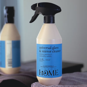 Bottle of Lenta Home universal glass & mirror cleaner with a blue label on a blurred background.