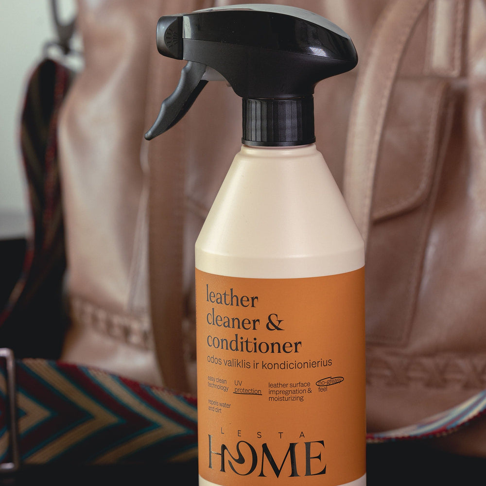Leather cleaner and conditioner spray bottle with beige and black design on a white background